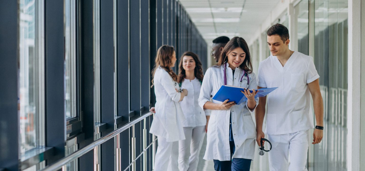 team-young-specialist-doctors-standing-corridor-hospital